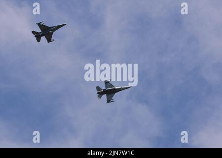 Two U.S. Air Force F-16 Fighting Falcons assigned to the 510th Fighter Squadron fly above Aviano Air Base, Italy, Aug. 8, 2022. The 510th FS is one of two F-16 Fighter Squadrons at Aviano AB that support the base’s many missions, including preparing fighter pilots, controllers, and support personnel to execute U.S. and NATO war plans and contingency operations. (U.S. Air Force photo by Senior Airman Brooke Moeder) Stock Photo