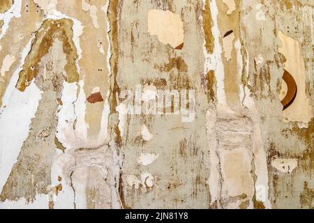 Traces on a scraped house facade ready for renovation Stock Photo