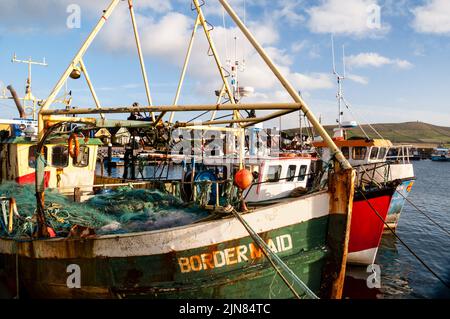 Fishing boats in the Irish Port Town of Dingle on the Dingle Peninsula. Stock Photo