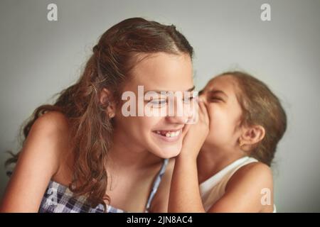 I tell her all my secrets. two young girls spending time together at home. Stock Photo