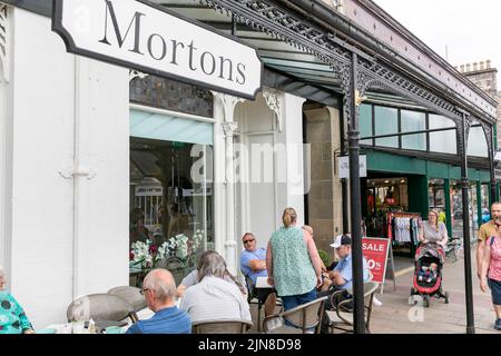 Pitlochry town centre Perthshire, Mortons Coffee lounge cafe, busy with customers eating drinking outside ,Scotland,UK,summer 2022 Stock Photo