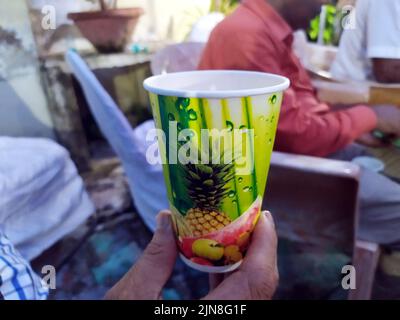 a paper drink glass hold in hand Stock Photo