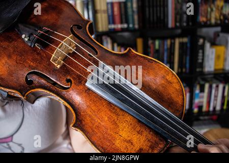 professional girl violinist playing an antique violin Stock Photo