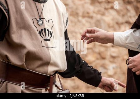 Medieval merchants negotiating deals at medieval castle Stock Photo