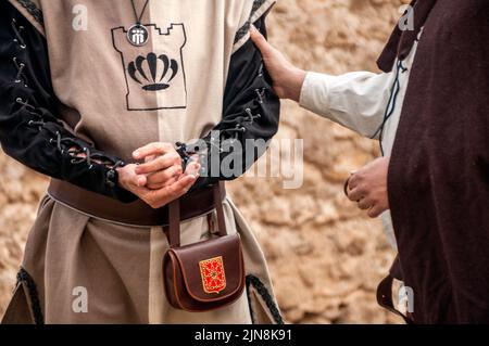 Medieval merchants negotiating deals at medieval castle Stock Photo