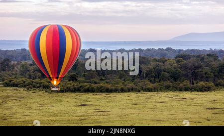Hot Air Ballooning over Maasai Mara plains, Kenya. Africa Stock Photo