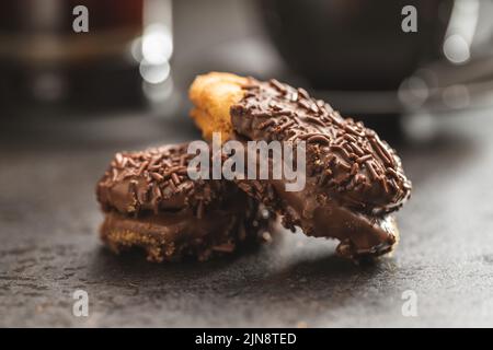 Petit fours with chocolate sprinkles. Mini chocolate dessert. Stock Photo