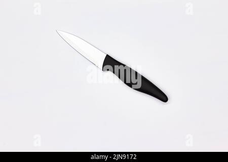 Kitchen knife for vegetables on white background. Chef Butchers knife for peeling and cutting vegetables and fruits. Kitchenware. Professional food pr Stock Photo