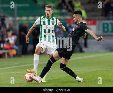 BUDAPEST, HUNGARY - AUGUST 9: Gara Garayev of Qarabag FK fouls Aissa  Laidouni of Ferencvarosi TC during the UEFA Champions League Qualifying  Round match between Ferencvarosi TC and Qarabag FK at Ferencvaros