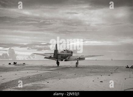 The first Fairey Firefly of 1770 Squadron, Fleet Air Arm with rockets attached, taking off from the flight deck of HMS Indefatigable during the carrier-borne air strike on the Japanese oil refinery at Pangkalan Brandan, Sumatra. The Firefly was a Second World War-era carrier-borne fighter aircraft and anti-submarine aircraft that was principally operated by the Fleet Air Arm. Stock Photo