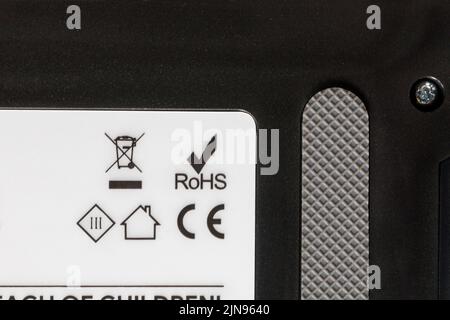 ROHS Restriction of Hazardous Substances, CE symbol logo and recycling information on robotic vacuum cleaner - disposal recycling recycle logo symbol Stock Photo