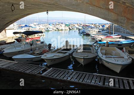 Famous landmarks, view from Ika's seaside promenade, central harbor vault, Adriatic coast, Kvarner bay, city details, Croatia Stock Photo