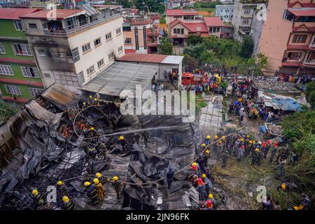 Kathmandu, Nepal. 10th Aug, 2022. Firefighters along with the help of the Army and Police personnel douse a fire that broke out in a shoe factory caused by a short circuit at Balaju, Kathmandu. (Photo by Skanda Gautam/SOPA Images/Sipa USA) Credit: Sipa USA/Alamy Live News Stock Photo