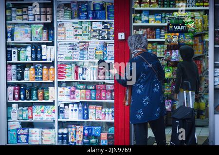 The customers in a small store in Paris on a rainy day. Stock Photo