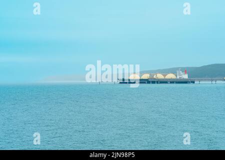 LNG carrier ship during loading at an liquefied natural gas offshore terminal Stock Photo