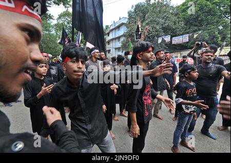 Dhaka, Bangladesh. 09th Aug, 2022. People participate in Ashura traditions in the Bihari Camp in Dhaka, Bangladesh on Aug. 9, 2022. In the capital Dhaka today, Shia community and Sunnis from Bihari camp observed Ashura with solemn fanfare, which was limited in last 2 years due to lock-down. (Photo by Md Saiful Amin/Pacific Press/Sipa USA) Credit: Sipa USA/Alamy Live News Stock Photo