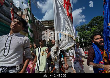 Dhaka, Bangladesh. 09th Aug, 2022. People participate in Ashura traditions in the Bihari Camp in Dhaka, Bangladesh on Aug. 9, 2022. In the capital Dhaka today, Shia community and Sunnis from Bihari camp observed Ashura with solemn fanfare, which was limited in last 2 years due to lock-down. (Photo by Md Saiful Amin/Pacific Press/Sipa USA) Credit: Sipa USA/Alamy Live News Stock Photo