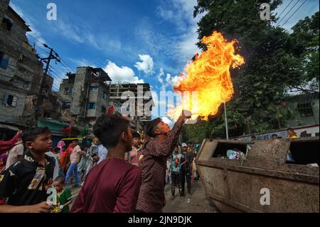 People participate in Ashura traditions in the Bihari Camp in Dhaka, Bangladesh on Aug. 9, 2022.  In the capital Dhaka today, Shia community and Sunnis from Bihari camp observed Ashura with solemn fanfare, which was limited in last 2 years due to lock-down. (Photo by Md Saiful Amin/Pacific Press/Sipa USA) Stock Photo