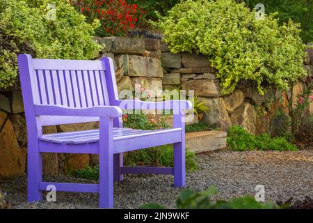 Idyllic corner with seat bench in Gramado garden, Southern Brazil Stock Photo