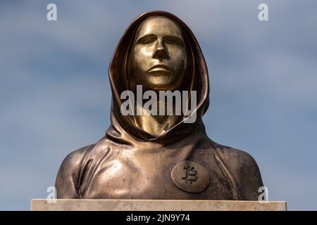 Budapest, Hungary -August 7, .2022:  Portrait of the statue of Satoshi Nakamoto mysterious founder of Bitcoin and Blockchain technology in; created by Stock Photo