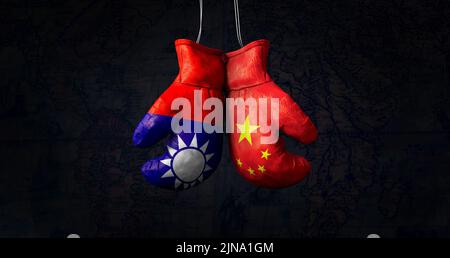 Hanging boxing gloves with the National Flag of the People's Republic of China and flag of the Republic of China illustrate the tensions between the t Stock Photo