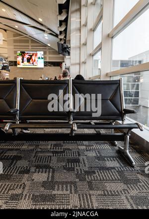 Empty seats at an airport terminal in Detroit Metro Airport Stock Photo