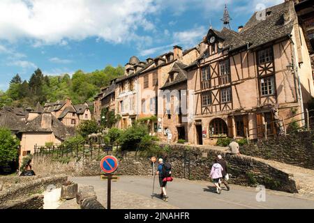 Conques is a former commune in the Aveyron department in Southern France, in the Occitania region. On 1 January 2016, it was merged into the new commune of Conques-en-Rouergue. The village is located at the confluence of the rivers Dourdou de Conques and Ouche. It is built on a hillside and has classic narrow medieval streets. As a result, large vehicles such as buses cannot enter the historic town centre and must park outside. Consequently, most day visitors enter on foot. The town was largely passed by in the nineteenth century, and was saved from oblivion by the efforts of a small number of Stock Photo
