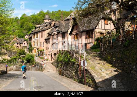 Conques is a former commune in the Aveyron department in Southern France, in the Occitania region. On 1 January 2016, it was merged into the new commune of Conques-en-Rouergue. The village is located at the confluence of the rivers Dourdou de Conques and Ouche. It is built on a hillside and has classic narrow medieval streets. As a result, large vehicles such as buses cannot enter the historic town centre and must park outside. Consequently, most day visitors enter on foot. The town was largely passed by in the nineteenth century, and was saved from oblivion by the efforts of a small number of Stock Photo