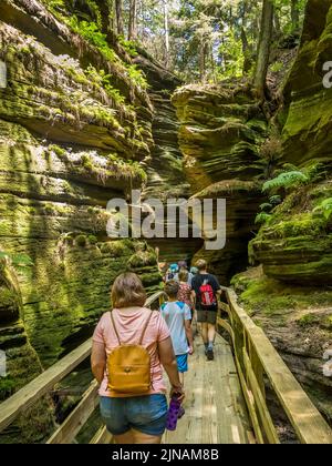 Tourist in Witches Gulch on the Wisconsin River in wisconsin dells in the state of Wisconsin USA Stock Photo