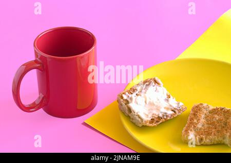 Red cup of coffee with toast and butter for breakfast of the day. Stock Photo