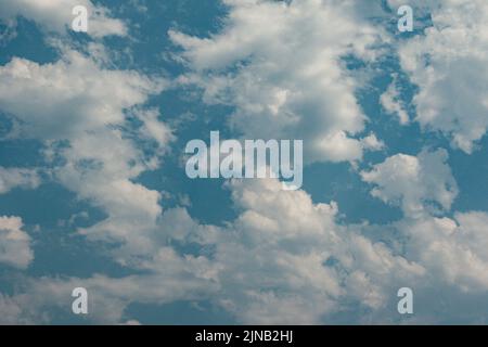white wispy clouds against blue sky Stock Photo