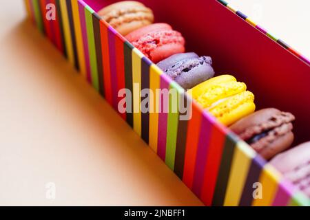 Macaroons packed in colourful box Stock Photo
