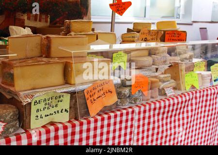 Traditional French cheese stall on the  food market in France Stock Photo