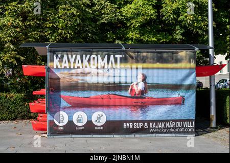 Unmanned kayak rental at Saltangen waterfront in Norrkoping. Norrkoping is a historic industrial town build along Motala river. Stock Photo