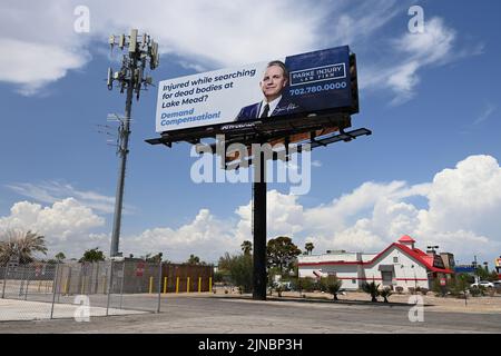 Las Vegas, Nevada, USA. 10th Aug, 2022. A billboard reading 'Injured while searching for dead bodies at Lake Mead? Demand Compensation!'' is seen along a stretch of road in Las Vegas, Nevada on August 10, 2022. As a result of lowering water levels due to extreme drought, authorities have discovered four sets of human remains since May in Lake Mead, the country's largest reservoir. The attorney, Steven Parke, who created the roadside sign, told a local TV station that the billboard was meant to be a joke. (Credit Image: © David Becker/ZUMA Press Wire) Stock Photo