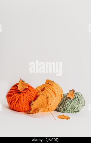 Knitting balls in autumn colors. Place for text Stock Photo