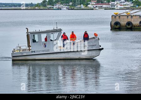 Vessel from the Canadian Coast Guard College located in Sydney Nova Scotia in a training exercize within Sydney harbour. Stock Photo