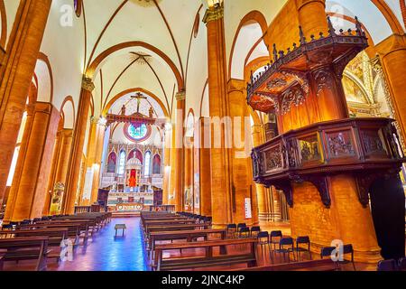 PAVIA, ITALY - APRIL 9, 2022: The old wooden pulpit in gothic Church of Santa Maria del Carmine, on April 9 in Pavia, Italy Stock Photo