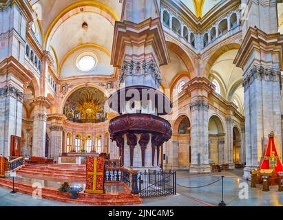 PAVIA, ITALY - APRIL 9, 2022: Panorama of the interior of Duomo di Pavia with wooden pulpit and the main Altar, on April 9 in Pavia, Italy Stock Photo