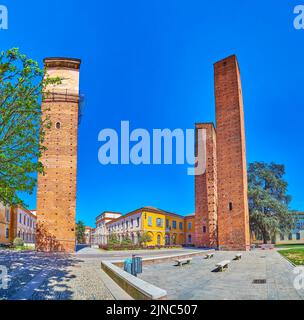 Panorama of Piazza Leonardo da Vinci with its three medieval towers, Pavia, Italy Stock Photo