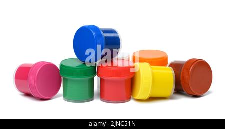 Plastic jars with multi-colored gouache on a white isolated background Stock Photo