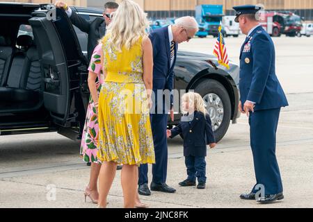 United States President Joe Biden, with his grandson Beau Biden II and First Lady Jill Biden (L), walks to board to board Air Force One at Joint Base Andrews, Maryland, USA, 10 August 2022.Credit: Shawn Thew/Pool via CNP /MediaPunch Stock Photo