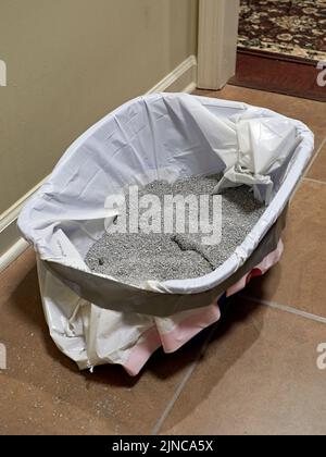 Dirty used kitty or cat litter in a kitty litter cat box. Stock Photo
