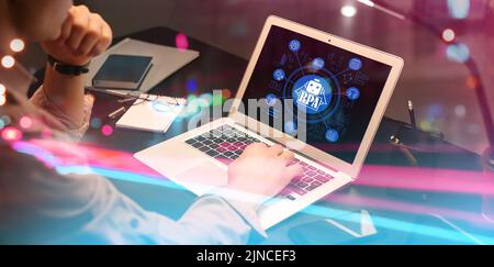 Businessman working on laptop in office. RPA concept Stock Photo