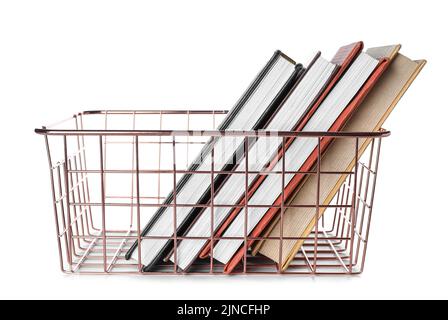 Pink metal basket with books on white background Stock Photo