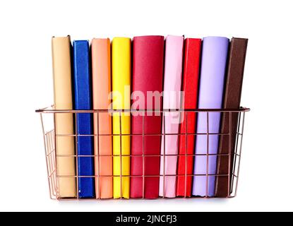 Pink metal basket with books on white background Stock Photo