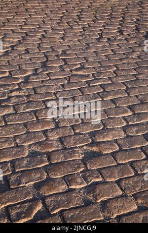 Close-up of brownish rectangular cobble style paving stones, Old Port of Montreal, Quebec, Canada. Stock Photo