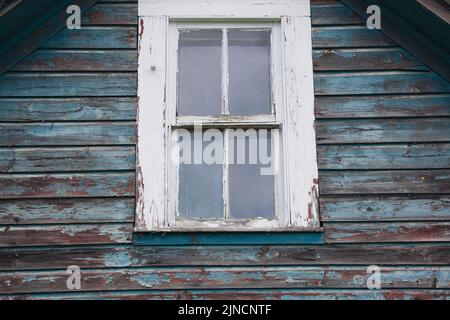 Close-up of glass pane window on old abandoned house. Stock Photo
