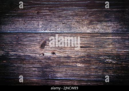 Old rustic wooden picnic table background texture surface from the top. Stock Photo