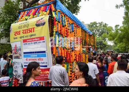 New Delhi, India July 01 2022 - A huge gathering of devotees from different parts of Delhi on the occasion of ratha yatra or rathyatra. Rath for Lord Stock Photo